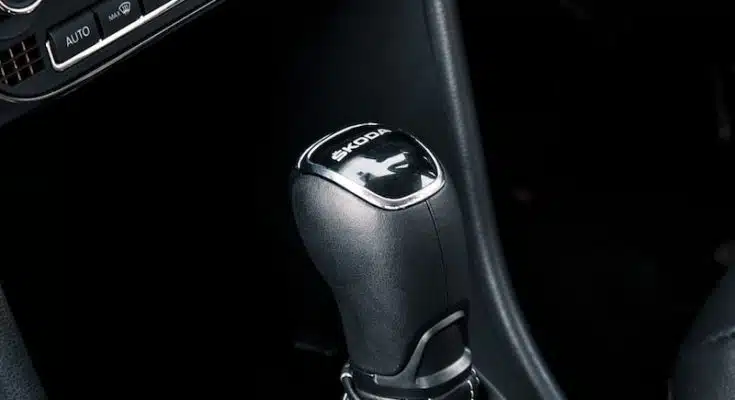 black and silver car gear shift lever