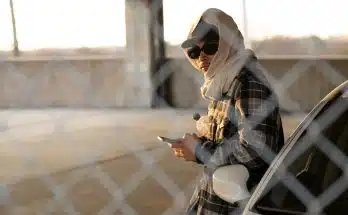 Man Wearing Cap and Headscarf